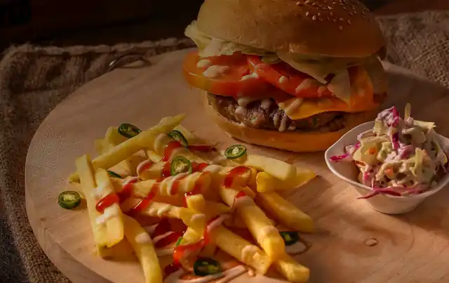 a gourmet hamburger and french fries, made at home with Sander's Markets ingredients